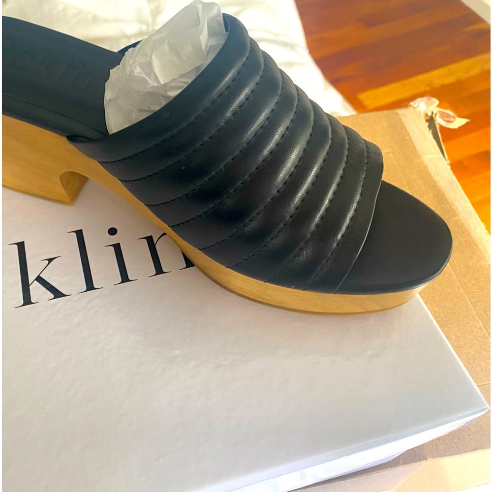 Brand new peep toe leather clogs by Beklina.